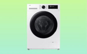White Samsung front load washing machine featuring a black door, designed for efficient laundry care.