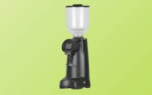 A commercial coffee grinder displayed against a vibrant green background, showcasing its sleek design and functionality.