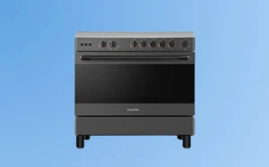 A black and white stove set against a vibrant blue background, showcasing its classic design and modern appeal.