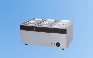 Three-compartment hot plate featuring two trays for cooking multiple dishes simultaneously.