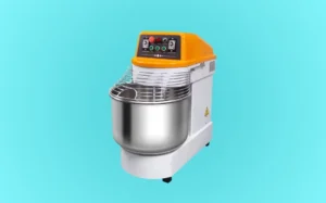 Spiral mixer with a yellow lid, prominently displayed against a blue background.