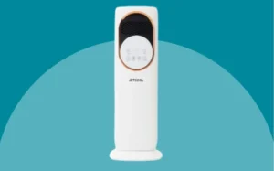 A white and gold toothbrush displayed against a blue background, highlighting its sleek design and color contrast.