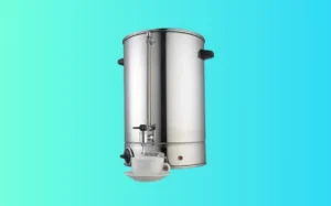 Stainless steel coffee machine with a cup holder, designed for brewing hot beverages efficiently.